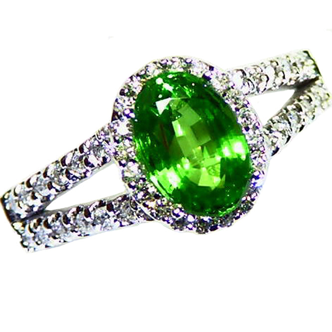 Bright green, natural tsavorite garnet diamond halo white gold ring